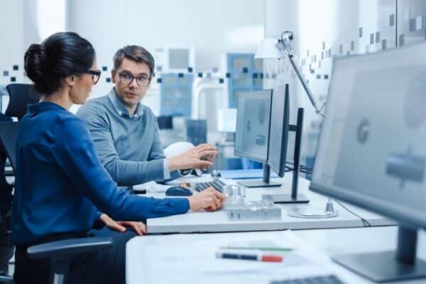 man and woman working at desk